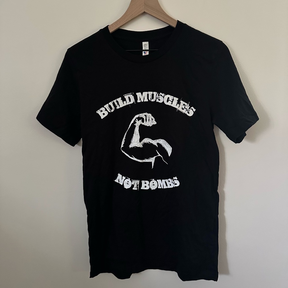 Graphic Tee Build Muscles Not Bombs Black and White